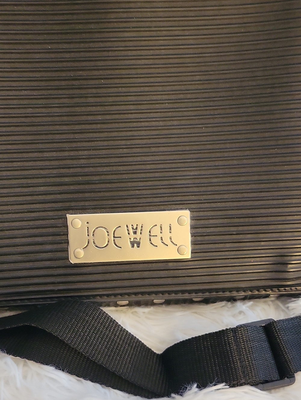 JOEWELL Black Ribbed Crossbody Bag There Is A Cut On Each Side Of The Flap.